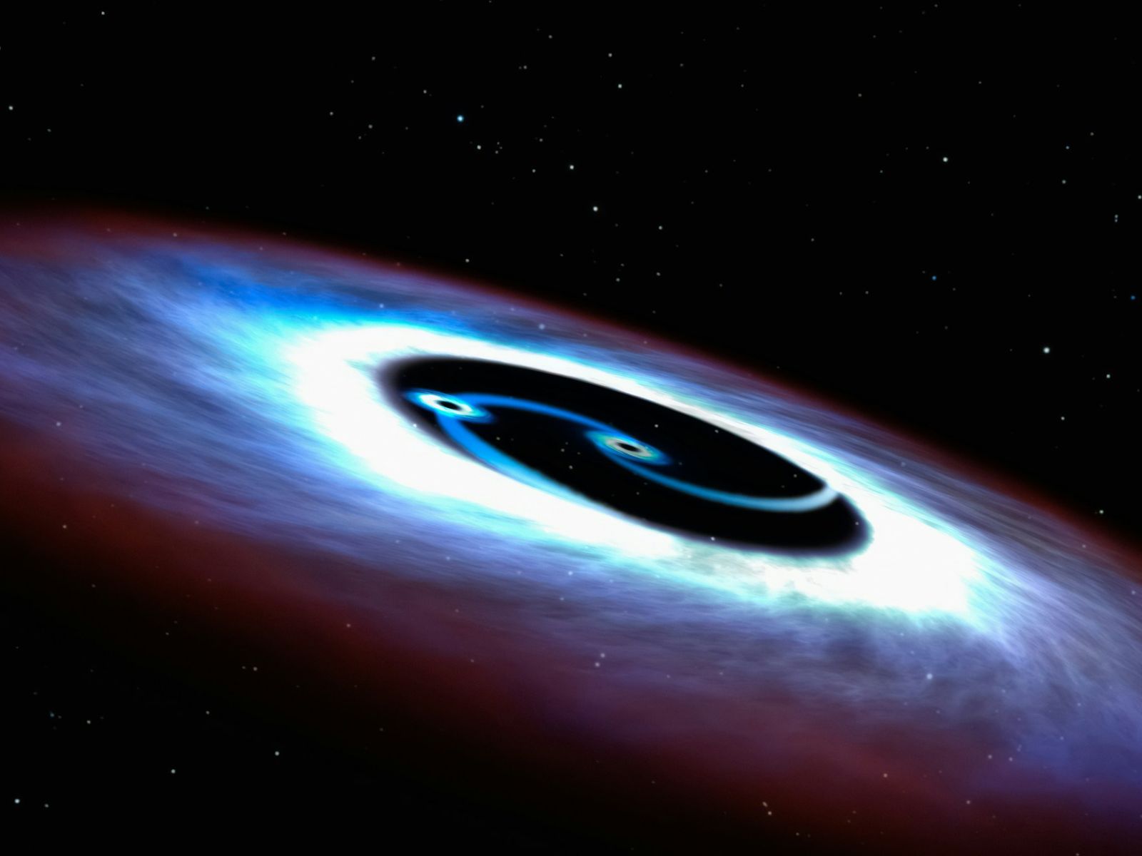 Tre buchi neri supermassicgi nella stessa galassia: scoperta storica